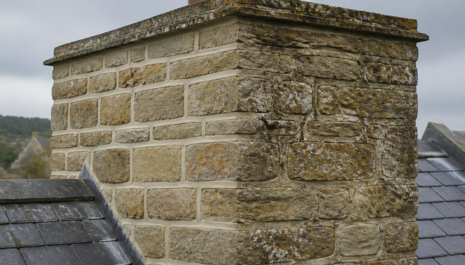 Cotswold stone chimney freshly repointed with lime mortar by White Horse Roofing Services, Oxfordshire